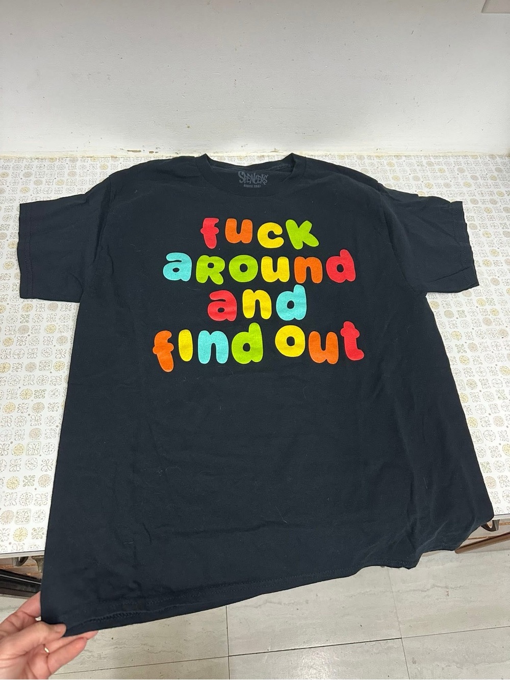 Spencer's Black Tee with Bright Multicolor Bubble Letters